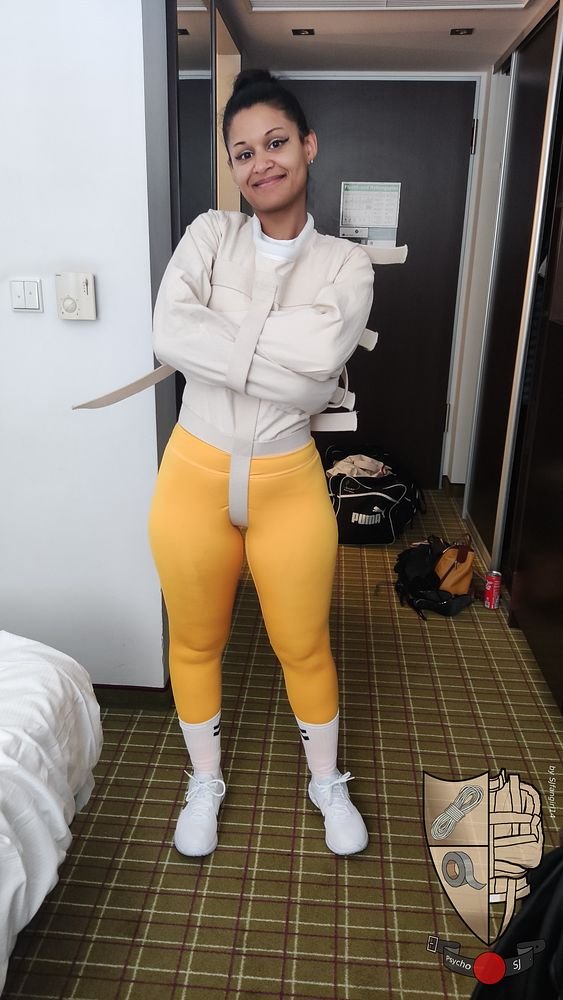 Calisa Bliss in a straitjacket and leggings (PsychoSJ)